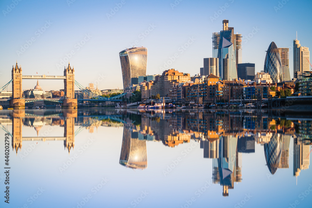 Tower Bridge and the bank district of central London with reflection