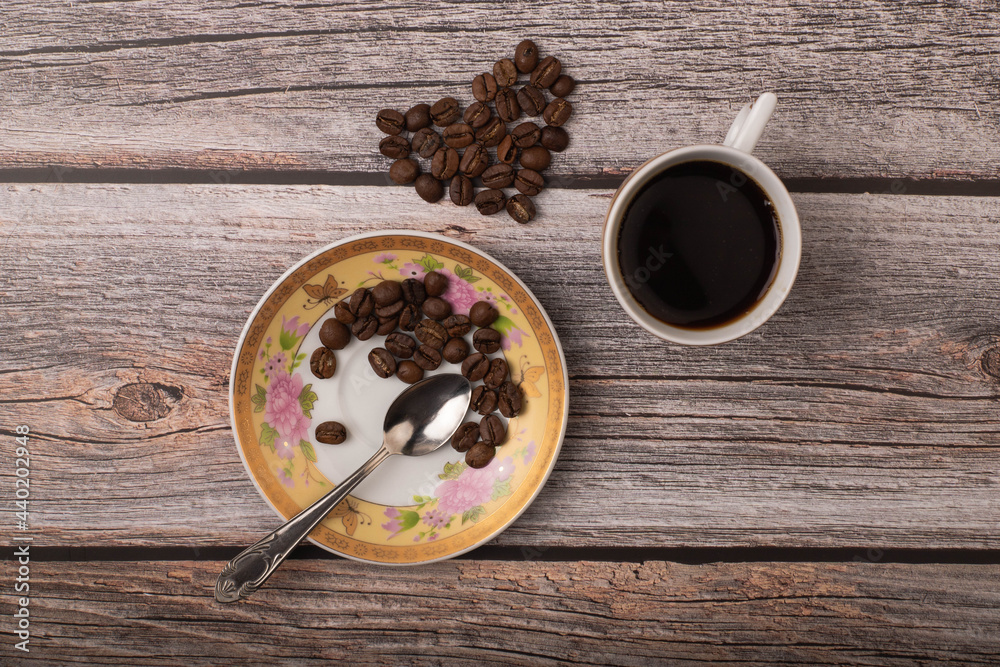 dark coffee and grains on wooden background dark coffee and grains on wooden background