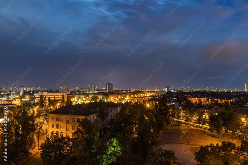 Fototapeta premium Lightning strike over Kiev in purple.