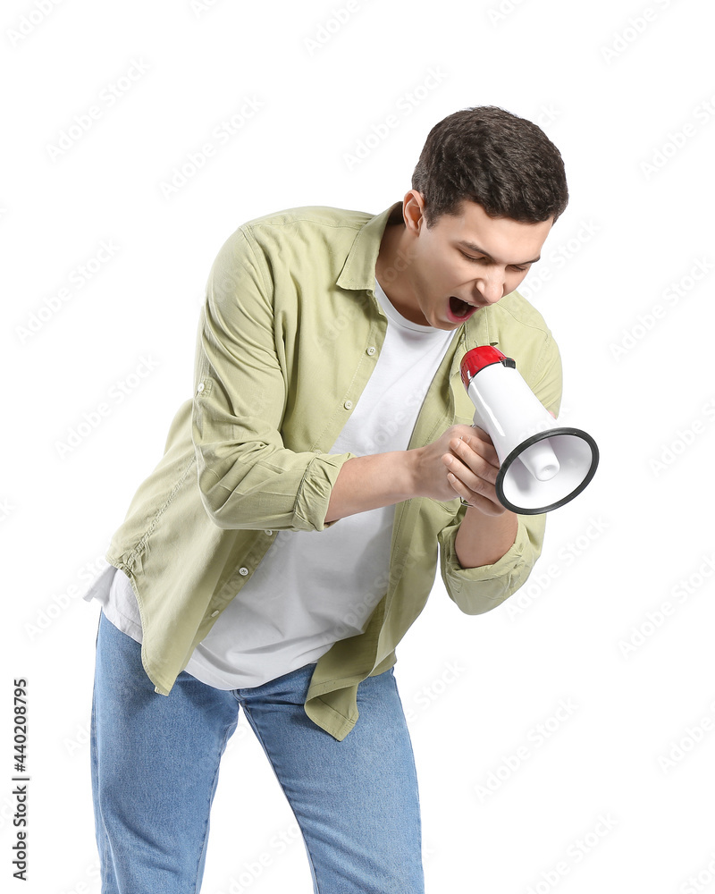 Handsome young man shouting into megaphone on white background Handsome young man shouting into megaphone on white background