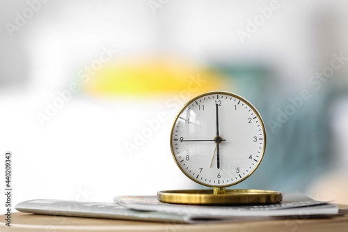 Alarm clock on table in bed...
