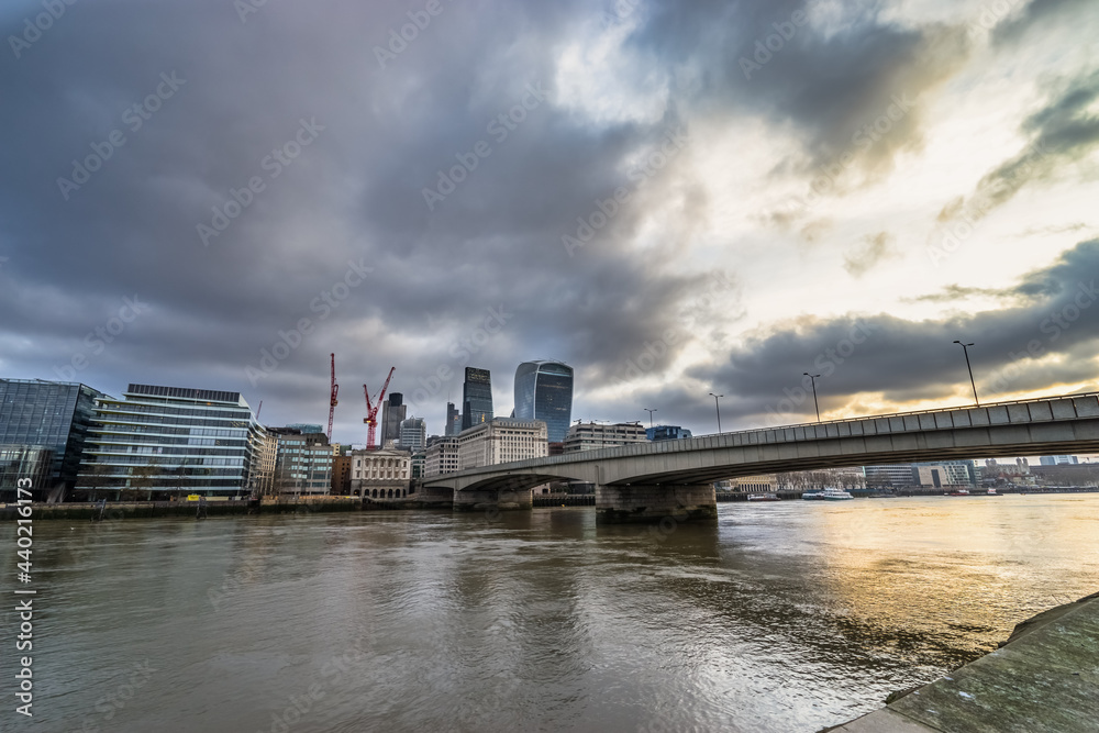 London bridge near south bank district with cloudy morning sky