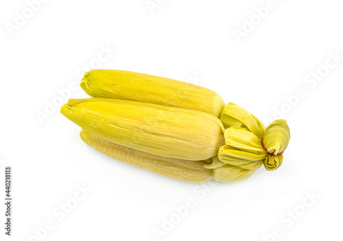 Organic group of fresh corn streamed in shell, the isolated image on white background.