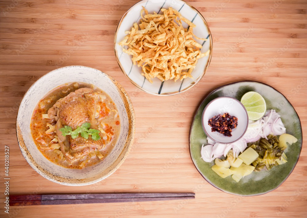 Khao Soi Kai, Northern Style Egg Noodle in Chicken Curry With Ingredients. Thai Food Khao Soi Kai, Northern Style Egg Noodle in Chicken Curry With Ingredients. Thai Food