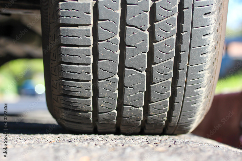Obraz premium New pickup truck tire on the road