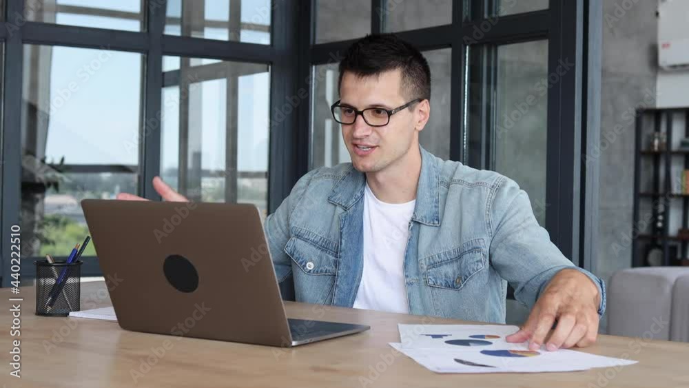 Successful businessman applauding employees for good job and successful financial month, caucasian man uses laptop computer for video meeting with colleagues, discussing a successful sales report Successful businessman applauding employees for good job and successful financial month, caucasian man uses laptop computer for video meeting with colleagues, discussing a successful sales report