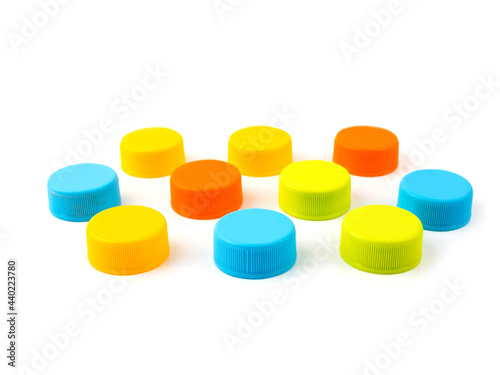 Colorful Plastic bottle caps on white background. selective focus