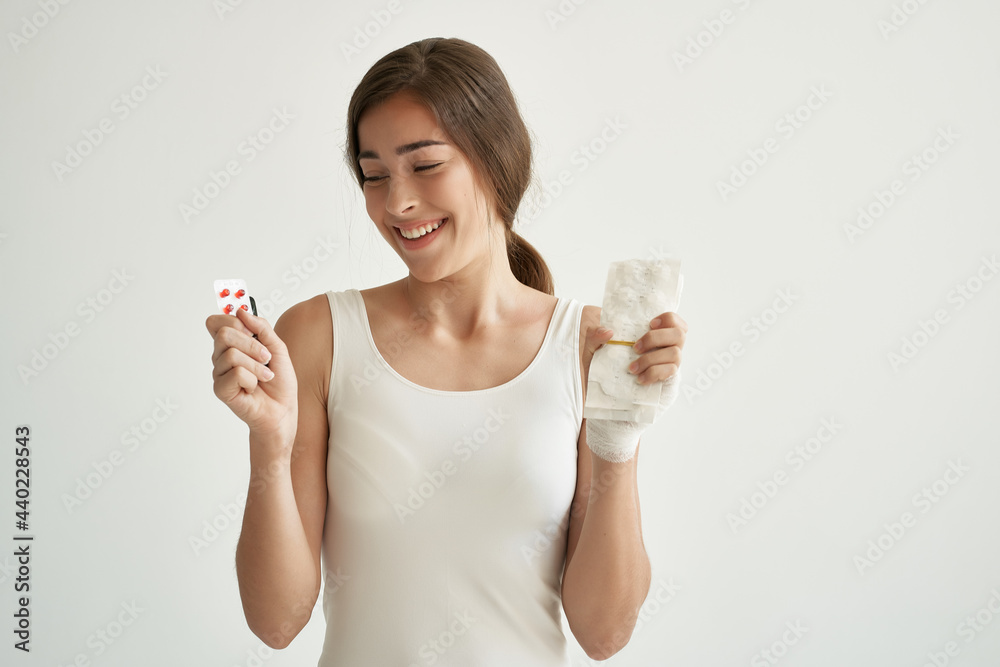 woman with bandaged hand medicine white tank top treatment woman with bandaged hand medicine white tank top treatment