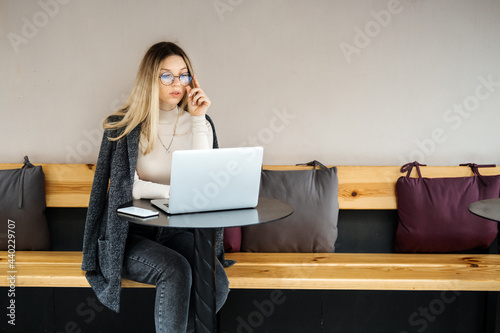 Side Jobs to Make Some Extra Money. Earn extra money, Side hustle, money making, Gig economy, hustling, digital nomad. Young woman, student with laptop and smartphone working outside