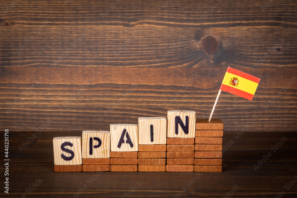 Spain. Wooden alphabet cubes on a wooden background Spain. Wooden alphabet cubes on a wooden background