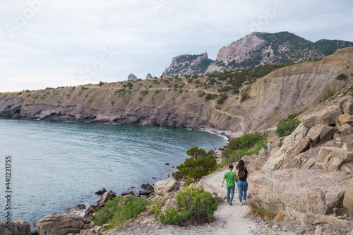 People walk along the Galitsin trail in a Novy Svet in the Crimea photo