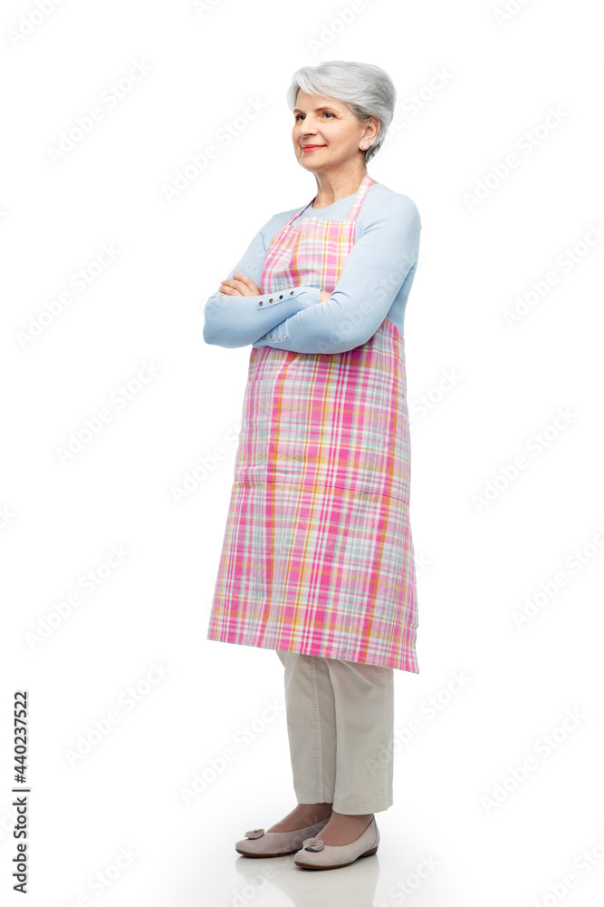 cooking, culinary and old people concept - portrait of smiling senior woman in kitchen apron with crossed arms over white background cooking, culinary and old people concept - portrait of smiling senior woman in kitchen apron with crossed arms over white background