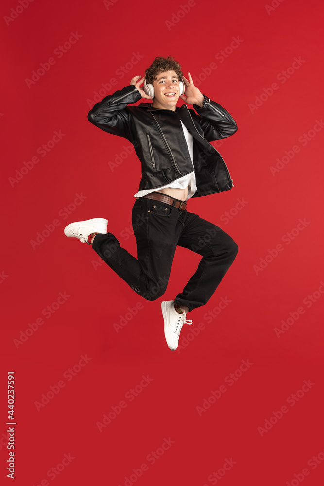 Male portrait isolated over red studio background with copyspace Male portrait isolated over red studio background with copyspace
