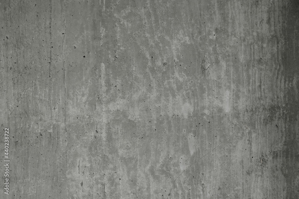 texture a concrete wall with exposed air bubbles on it