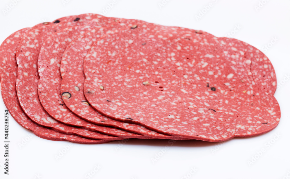 sliced vegetarian sausage is reminiscent of pepperoni sliced vegetarian sausage is reminiscent of pepperoni