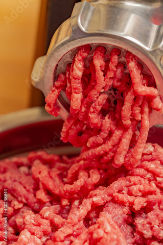 meat and grinder close up. Minced meat and meat grinder. Minced cutlets cooking for dinner