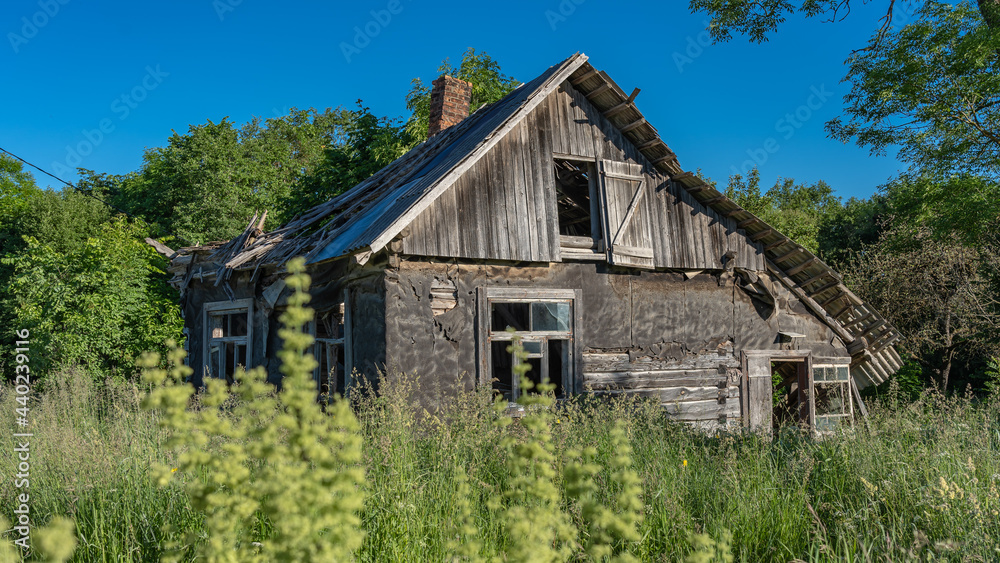 An old abandoned farmhouse. Broken windows. Broken roof.