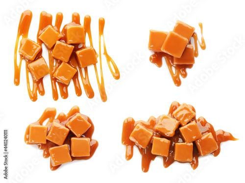 Set of delicious caramel candies with sauce on white background, top view