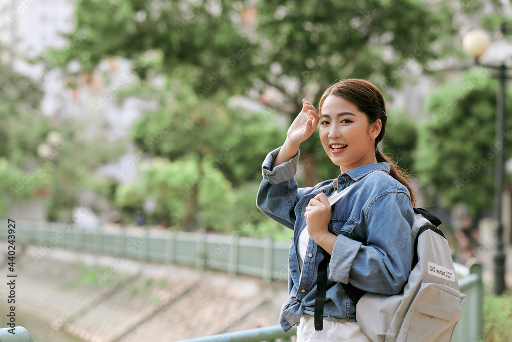 Joyful asian girl posing with soft sun light. Space for text Joyful asian girl posing with soft sun light. Space for text