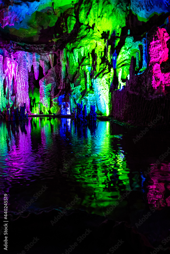 Fototapeta premium Nice cave formed by nature with stalactites, stalagmites, karst limestone