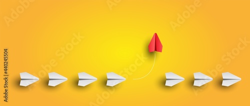 Individuality concept. Individual and unique leader red paper plane flies to the side