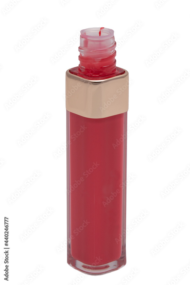 Lip gloss isolated. Close-up of open tube with red lip gloss for natural plump lips isolated on a white background. Make-up and beauty concept. Macro. Lip gloss isolated. Close-up of open tube with red lip gloss for natural plump lips isolated on a white background. Make-up and beauty concept. Macro.
