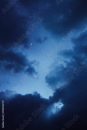 Photography Night sky with the moon framed by clouds