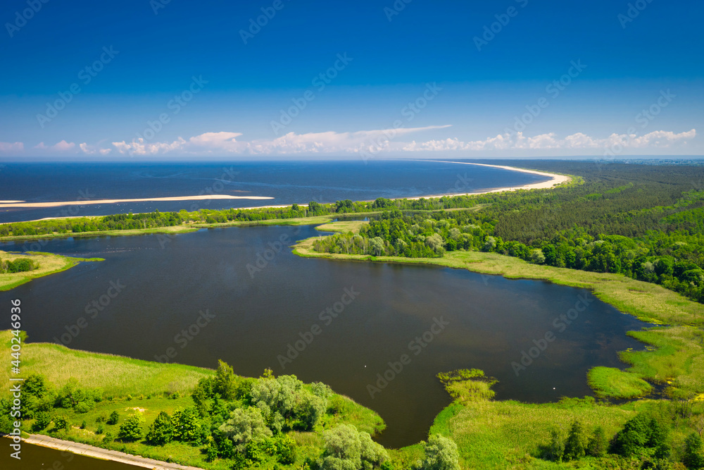 The beautiful scenery of the lake by the beach of the Baltic Sea, Mikoszewo. Poland - obrazy, fototapety, plakaty 