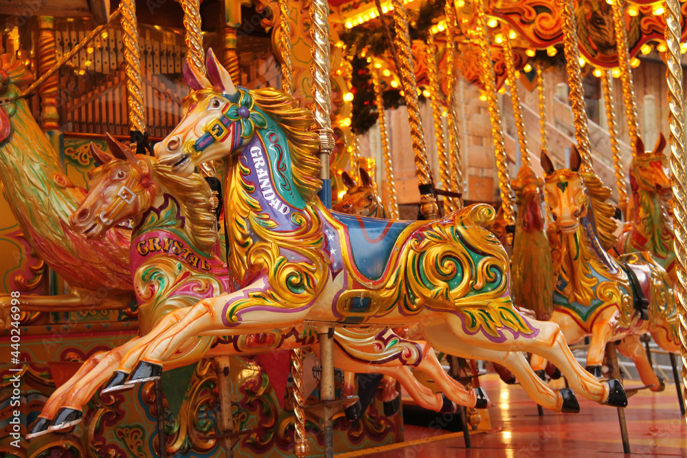 Wooden Carousel Horses on a Fun Fair Amusement Ride.