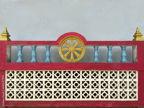 Fragment of the wall of an old Buddhist monastery. Religious relic. History. Buddhism religion. Golden dharma wheel. Buddhist Asian temple. Cultural heritage. Ancient buildings. Architecture of Asia photo