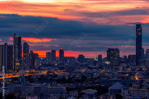 panoramic high-angle evening background of the city view,with natural beauty and blurred sunsets in the evening and the wind blowing all the time,showing the distribution of city center accommodation © bangprik
