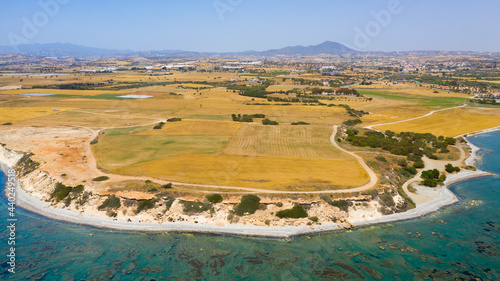 Akamas Peninsula from Paphos, Cyprus, aerial view of sea coastline, wild beach, yellow landscape, blue lagoon, popular tourist attraction