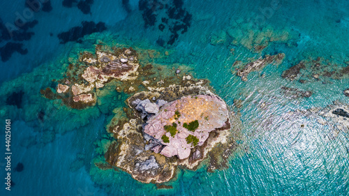 Aerial view of coastline of Cyprus beach.The steep stone cliffs and deep blue sea waves crushing in coves. beautiful turquoise waters of mediterranean © Sabina