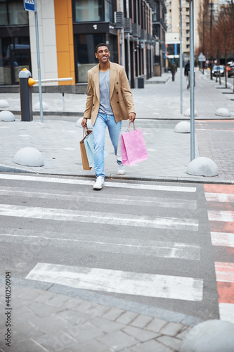 Handsome man feeling happiness after shopping process