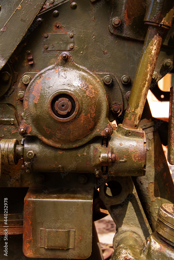 a fragment of the mechanism of old equipment, military weapons a fragment of the mechanism of old equipment, military weapons