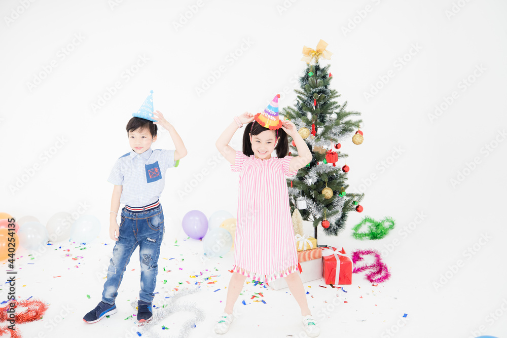 Boys and girls are having fun at a Christmas party. Boys and girls are having fun at a Christmas party.