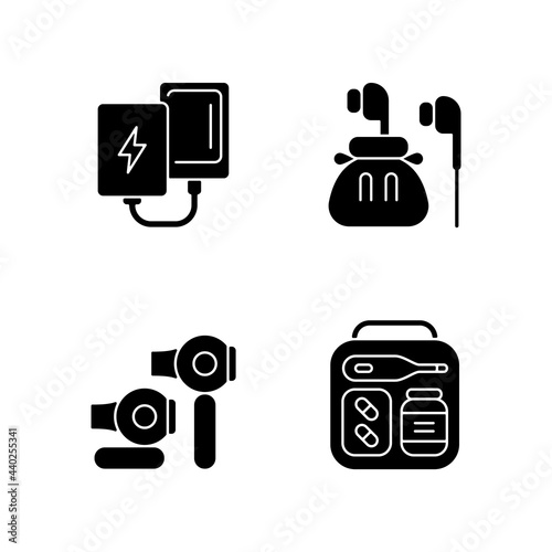 Traveller luggage black glyph icons set on white space. Compact powerbank and headphones. First aid kit. Mini size objects for tourist comfort. Silhouette symbols. Vector isolated illustration