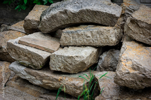 A pile of rocks. Stones for construction. Old stones.