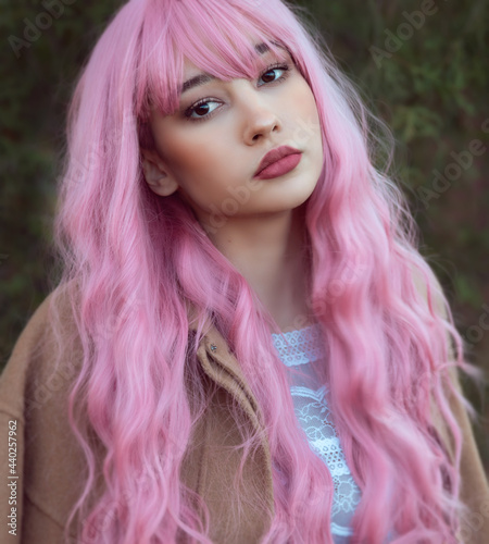 Young woman with pink hair outdoor portrait