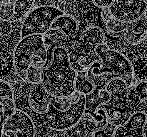 Beautiful abstract vector seamless pattern with handwritten curling lines, doodles and flowers	
