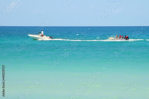 Cuba. August 09, 2019. Varadero: waterboat towing a banana boat photo