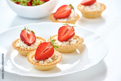 Close up tartlet with cottage cheese and strawberry