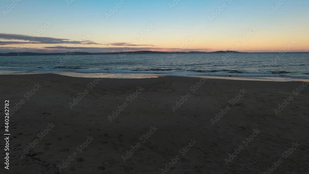 the popular Kingston Beach at dusk with soft sunset color and nobody on the beach, shot in Southern Tasmania the popular Kingston Beach at dusk with soft sunset color and nobody on the beach, shot in Southern Tasmania