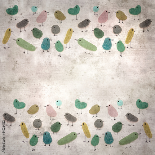 stylish textured old paper background with funny little birds made of sea glass pebble pieces  photo