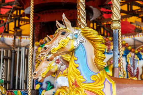 Brightly painted carousel pony at funfair.