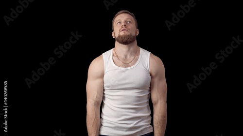 Serious Caucasian man talking with hands clasped. Actor on a black background. Monologue. High quality 4k footage