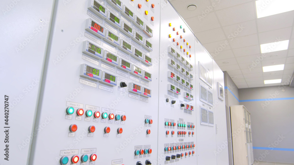 Shot of modern control panel with buttons and switches in factory control room