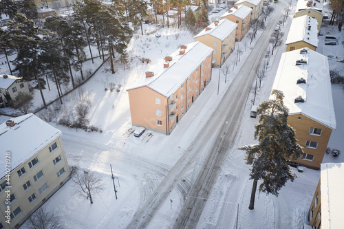 Blocks of flats along winter street photo