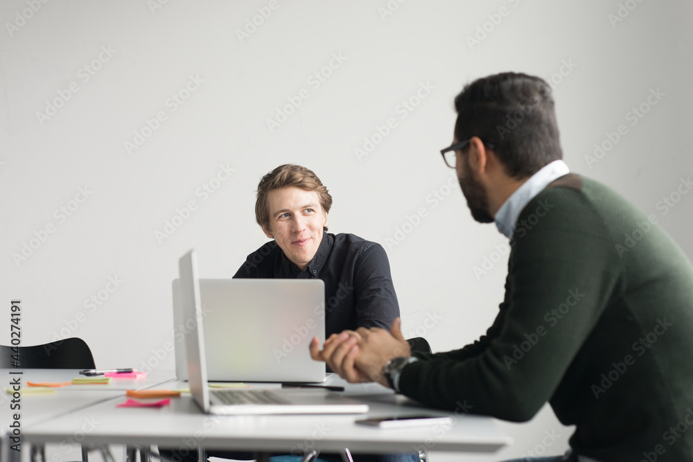 Coworkers talking in board room Coworkers talking in board room