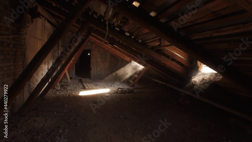 Old spooky attic of abandoned house photo